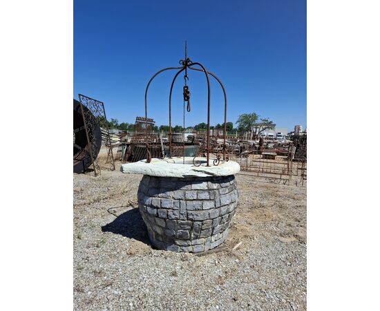 Stone well with iron arch