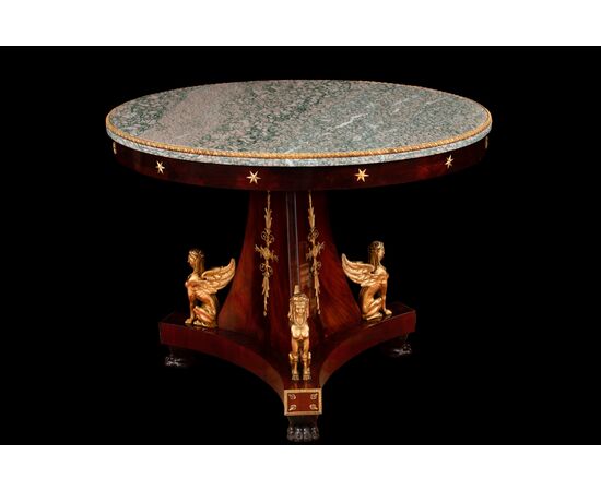 Circular mahogany feather table with marble top