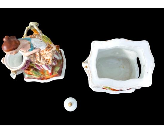 Figurative porcelain veilleuse with lady and floral decoration. France