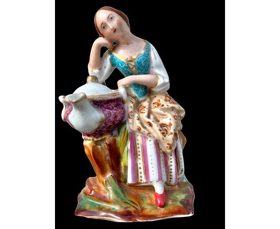 Figurative porcelain veilleuse with lady and floral decoration. France