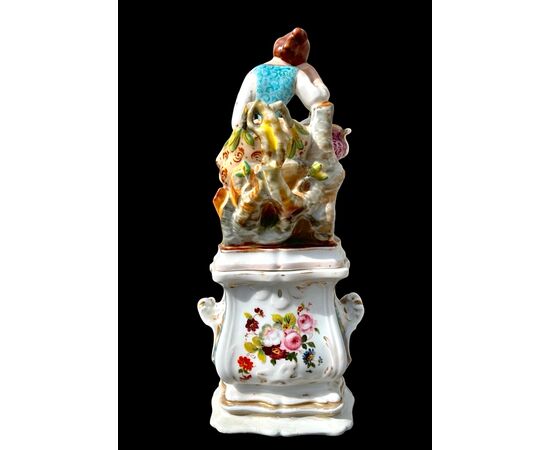 Figurative porcelain veilleuse with lady and floral decoration. France