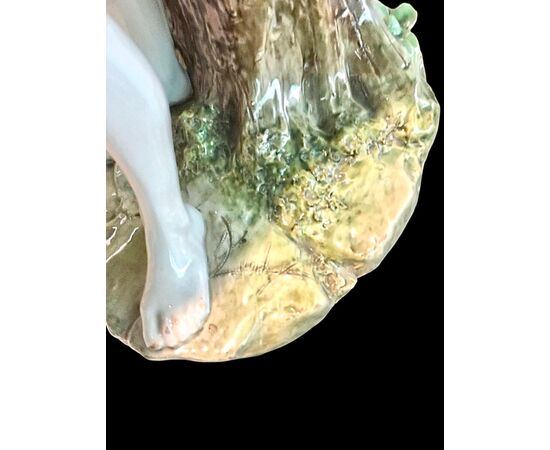 Polychrome majolica sculpture depicting a peasant drinking eggs. Ginori.