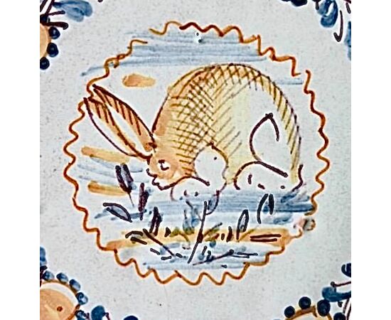 Majolica plate with a roundel depicting a hare. Vietri manufacture.