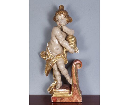 Scultura in legnio "Putto degustando miele"