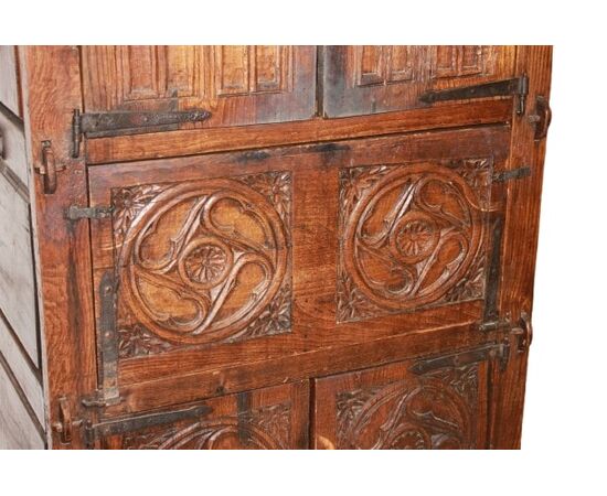 French cabinet from the early 1800s in richly carved oak wood