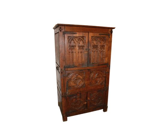 French cabinet from the early 1800s in richly carved oak wood