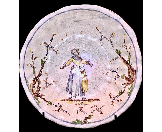 Majolica cup-basin decorated with a female figure and vegetal motifs. Levantino manufacture. Albisola.