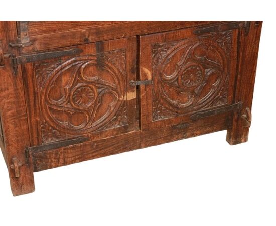 French cabinet from the early 1800s in richly carved oak wood