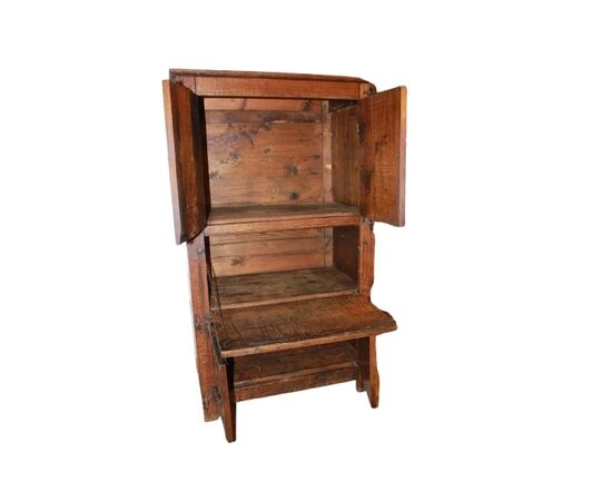 French cabinet from the early 1800s in richly carved oak wood