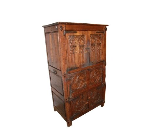 French cabinet from the early 1800s in richly carved oak wood
