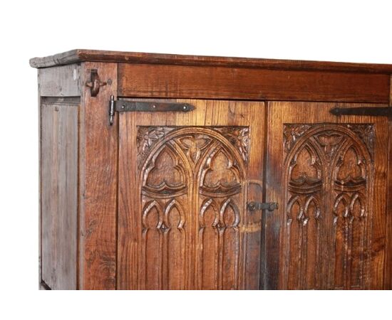 French cabinet from the early 1800s in richly carved oak wood