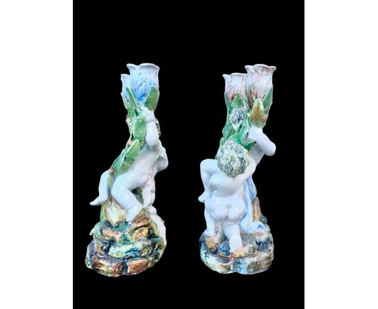 Pair of two-light majolica candlesticks with putti. Minghetti manufacture. Bologna.