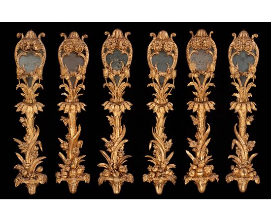 Six palace wall lights in carved and gilded wood and glass