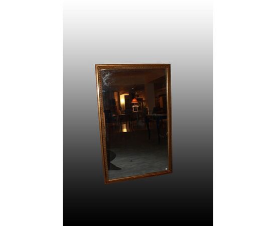 Large Louis XVI style gilded rectangular symmetrical mirror, 20th century