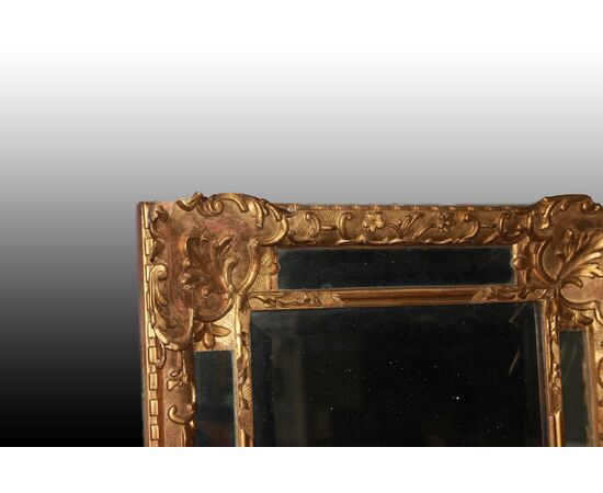 Graceful French mirror from the 1800s, Louis XVI style, gold leaf gilded.