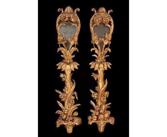 Six palace wall lights in carved and gilded wood and glass