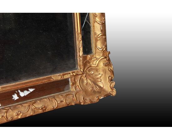 Graceful French mirror from the 1800s, Louis XVI style, gold leaf gilded.