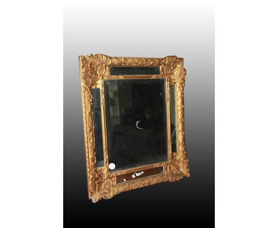 Graceful French mirror from the 1800s, Louis XVI style, gold leaf gilded.