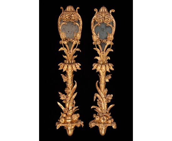 Six palace wall lights in carved and gilded wood and glass