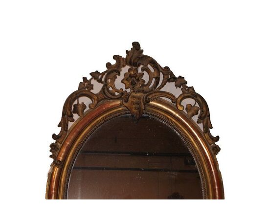 Antique Louis XV oval mirror, mid-1800s, French, gilded gold leaf, visible bole
