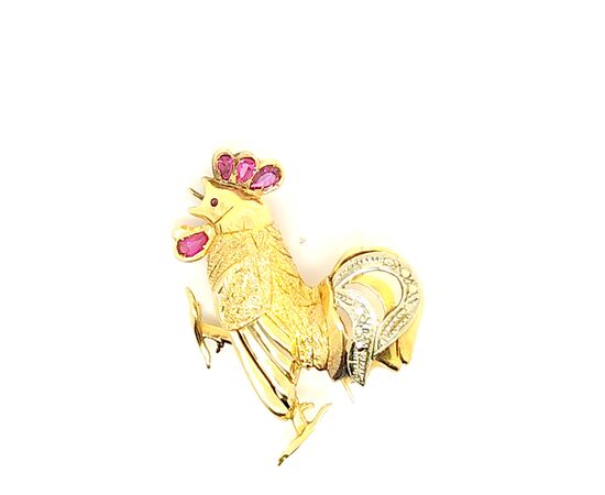 Spilla in oro con rubini e diamanti