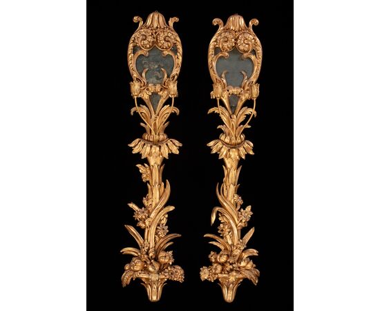 Six palace wall lights in carved and gilded wood and glass