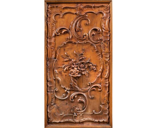 Pair of carved wooden wall panels. Italy, first half of the 20th century.