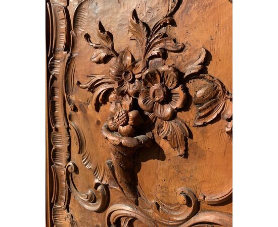 Pair of carved wooden wall panels. Italy, first half of the 20th century.