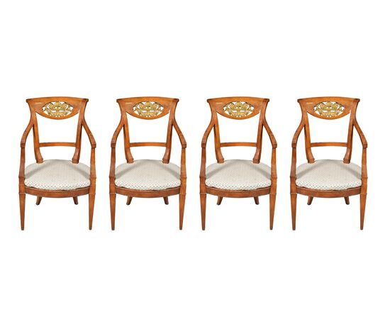 Four carved wooden armchairs. Italy, mid-19th century.