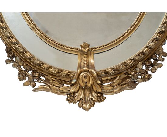 Specchiera antica a medaglione Napoleone III Francese in legno dorato e intagliato. Periodo XIX secolo.