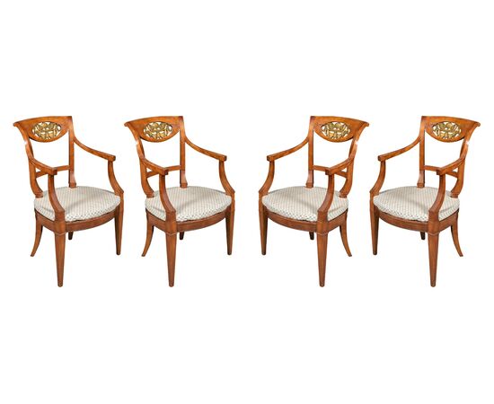 Four carved wooden armchairs. Italy, mid-19th century.