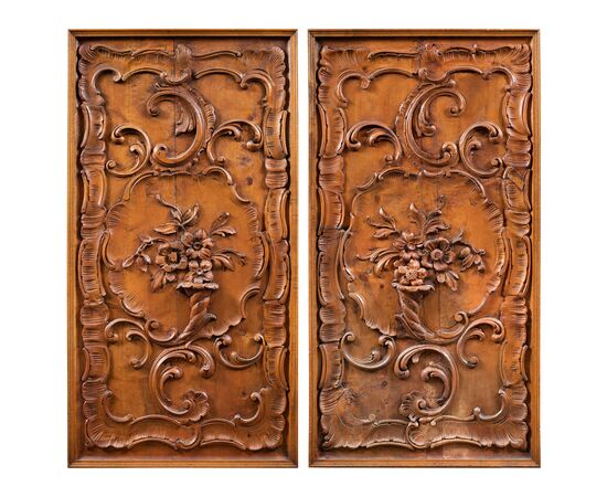 Pair of carved wooden wall panels. Italy, first half of the 20th century.