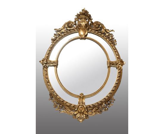 Specchiera antica a medaglione Napoleone III Francese in legno dorato e intagliato. Periodo XIX secolo.