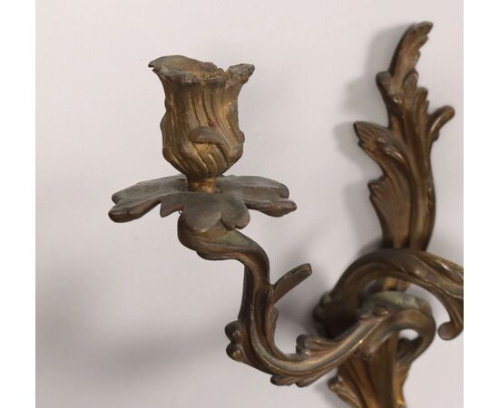 Group of five two-light bronze sconces. 19th century