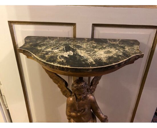 Half-moon console table with 17th-century Putto