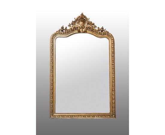 Antique French Napoleon III mirror in gilded and carved wood. 19th century period.