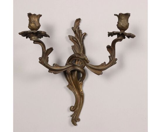 Group of five two-light bronze sconces. 19th century