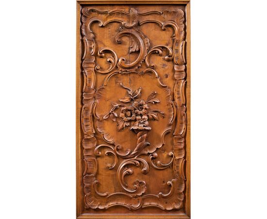 Pair of carved wooden wall panels. Italy, first half of the 20th century.