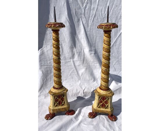 Pair of lacquered and painted wooden candlesticks. Venice, 18th/19th century.