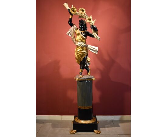Antique sculpture of a female Moor with a flowered cornucopia