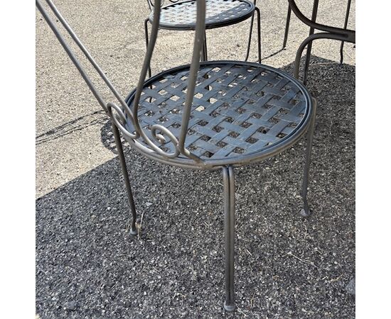 Large handmade wrought iron outdoor table with six chairs. Dimensions: 182 x 112 cm