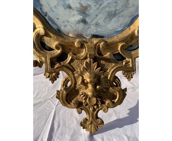 Pair of carved and gilded wooden mirrors. Italy, 18th century.