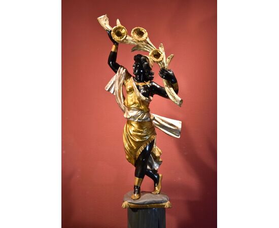 Antique sculpture of a female Moor with a flowered cornucopia