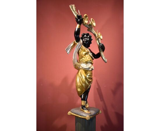 Antique sculpture of a female Moor with a flowered cornucopia