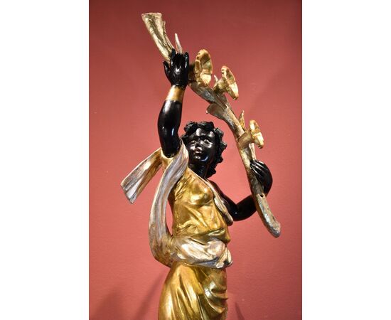 Antique sculpture of a female Moor with a flowered cornucopia