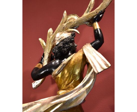 Antique sculpture of a female Moor with a flowered cornucopia