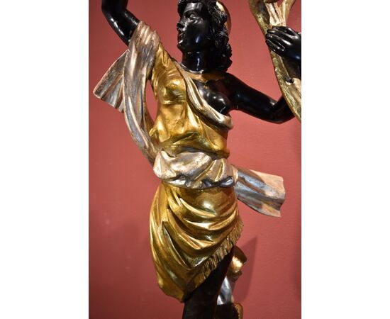 Antique sculpture of a female Moor with a flowered cornucopia
