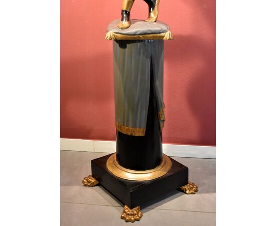 Antique sculpture of a female Moor with a flowered cornucopia