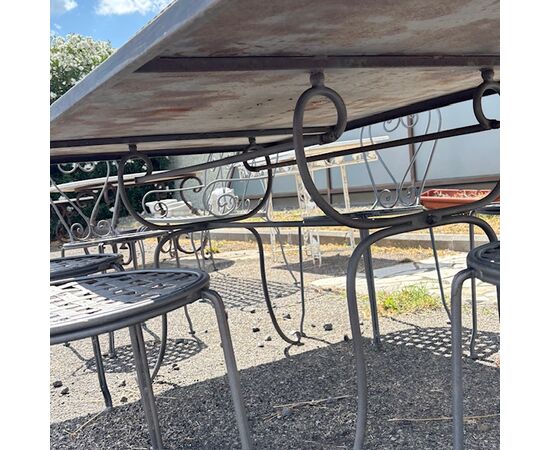 Large handmade wrought iron outdoor table with six chairs. Dimensions: 182 x 112 cm