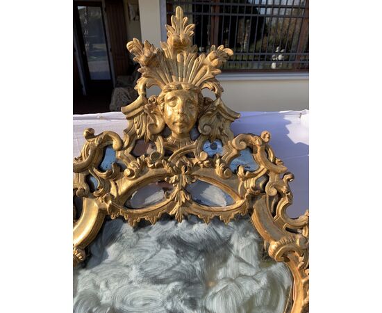 Pair of carved and gilded wooden mirrors. Italy, 18th century.